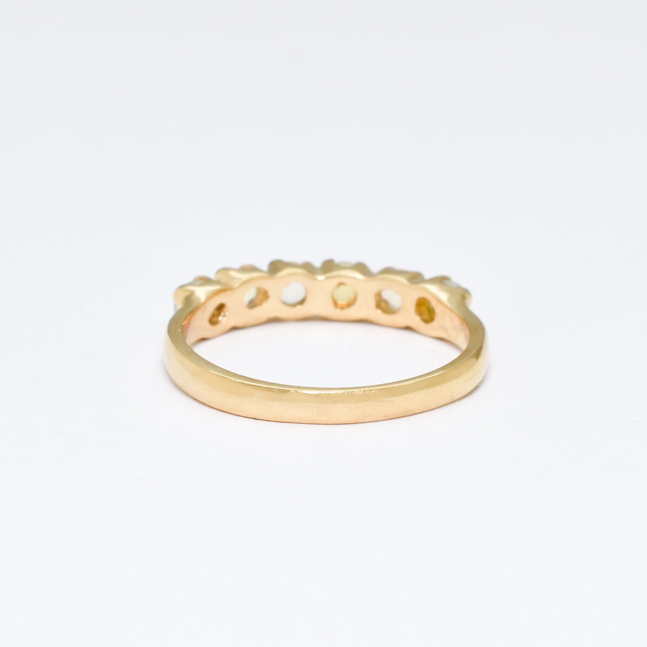 Ethiopian Opal eternity ring in gold with round cabochon gemstones, ideal for stacking or wearing solo, symbolizing everlasting love and inspiration, a meaningful October birthstone gift for weddings, anniversaries, and romantic milestones.