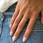 Ethiopian Opal Eternity Band stacked with colorful gemstone rings, worn with nude manicure and denim outfit, perfect for adding sparkle to everyday style and believed to boost inspiration, great for casual meetups and creative workdays.