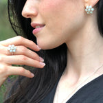 Natural Opal flower ring in sterling silver featuring round cabochon gemstones, ideal for elegant statement style, believed to inspire hope and creativity, perfect as an October birthstone gift for birthdays, anniversaries, and romantic celebrations.