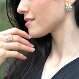 Natural Opal flower ring in sterling silver featuring round cabochon gemstones, ideal for elegant statement style, believed to inspire hope and creativity, perfect as an October birthstone gift for birthdays, anniversaries, and romantic celebrations.