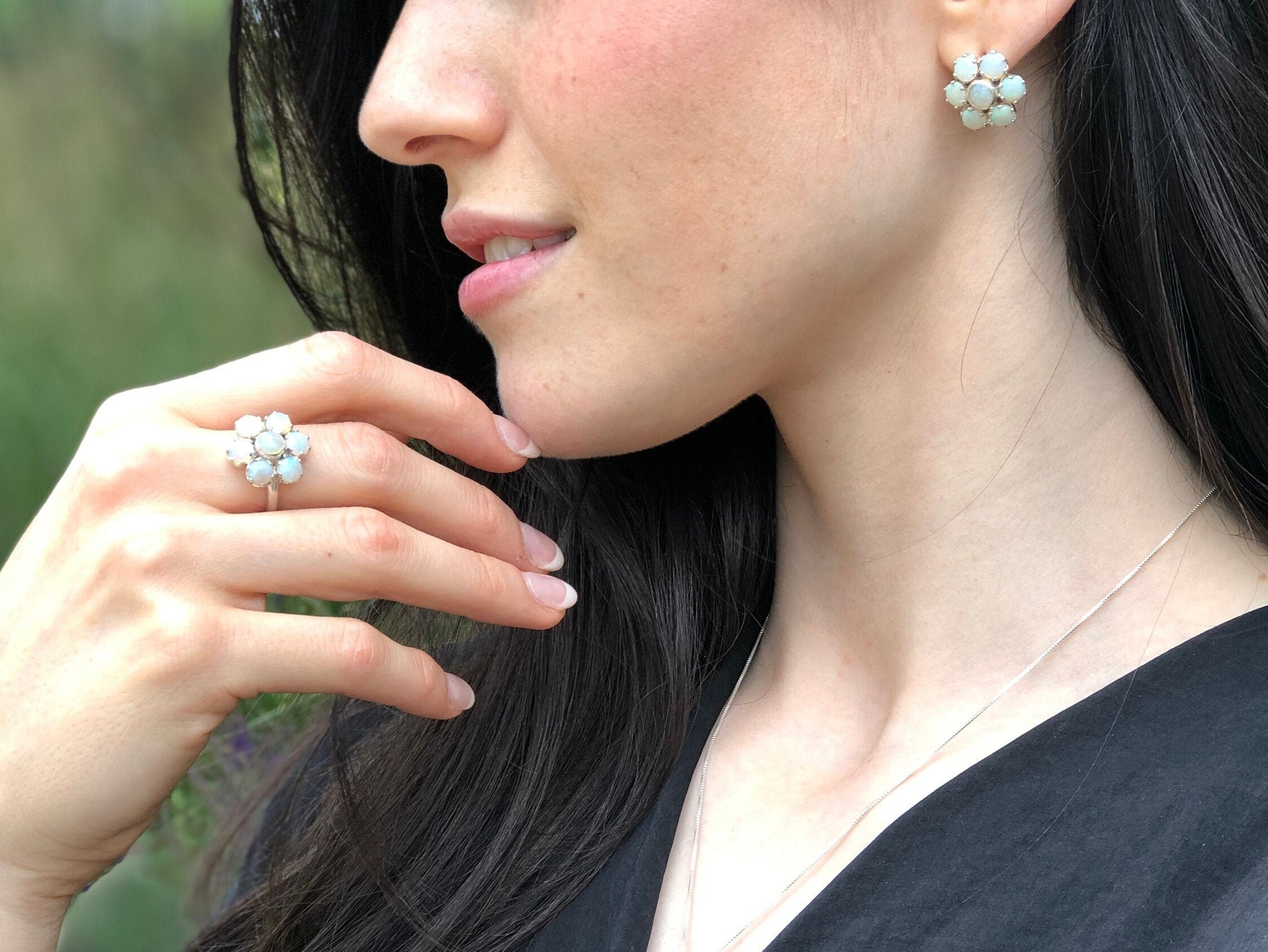 Natural Opal flower ring in sterling silver featuring round cabochon gemstones, ideal for elegant statement style, believed to inspire hope and creativity, perfect as an October birthstone gift for birthdays, anniversaries, and romantic celebrations.