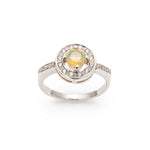 Ethiopian Opal diamond cut halo ring in solid 925 sterling silver, surrounded by sparkling CZ accents for brilliance and elegance. The halo design highlights flashes of fire colors while offering timeless durability. As the October Birthstone, Opal makes a meaningful gift for birthdays, engagements, anniversaries, or personal milestones. Perfect to wear at weddings, cocktail parties, and festive gatherings.