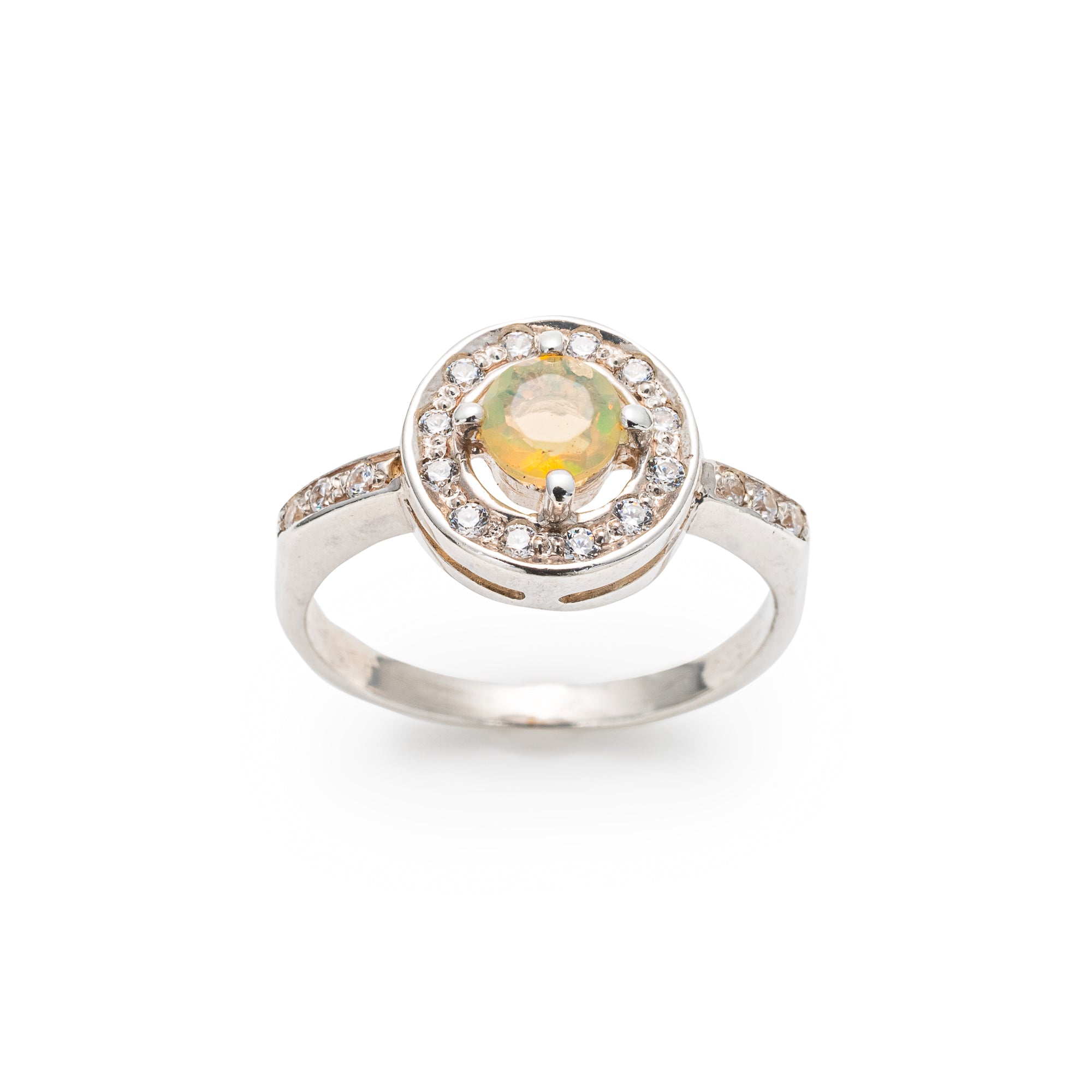 Ethiopian Opal diamond cut halo ring in solid 925 sterling silver, surrounded by sparkling CZ accents for brilliance and elegance. The halo design highlights flashes of fire colors while offering timeless durability. As the October Birthstone, Opal makes a meaningful gift for birthdays, engagements, anniversaries, or personal milestones. Perfect to wear at weddings, cocktail parties, and festive gatherings.