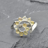 Opal Spiral Ring in sterling silver designed as a sunburst swirl statement jewelry piece offering radiant flashes of fire colors and boho charm, believed to inspire creativity and positivity, making it a thoughtful October birthstone gift idea. Perfect to wear at weddings, parties, and special occasions for a vibrant standout look.