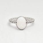 Natural Opal beaded silver ring with a smooth cabochon cut gemstone, offering a minimalist yet elegant style perfect for everyday wear. Opal, the October birthstone, is believed to inspire creativity and emotional balance, making it a meaningful gift for birthdays, anniversaries, weddings, and milestone celebrations.
