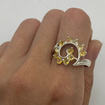 Flower Opal Ring worn on index finger with bare nails, perfect for adding a boho statement and enhancing personal expression, believed to bring joy as an October birthstone gift, ideal for day parties and brunch outings.