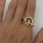 Flower Opal Ring worn on index finger with nude nails, showcasing a chic spiral design that boosts confidence and individuality, a meaningful October birthstone gift, perfect for weddings and evening gatherings.