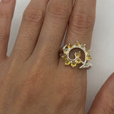 Flower Opal Ring worn on index finger with nude nails, showcasing a chic spiral design that boosts confidence and individuality, a meaningful October birthstone gift, perfect for weddings and evening gatherings.