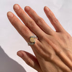 Opal Wave Ring in sterling silver bezel set with CZ pave worn on index finger with natural nails, shimmering with rainbow fire colors, ideal for minimalist and elegant outfits, symbolizing love and creativity, a thoughtful October birthstone present for birthdays and anniversaries.