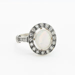 White Opal oval bezel halo ring with Victorian vintage design in solid 925 sterling silver, featuring flashes of fire colors for energy and inspiration, perfect as an October birthstone gift and for engagements, anniversaries, or elegant celebrations.