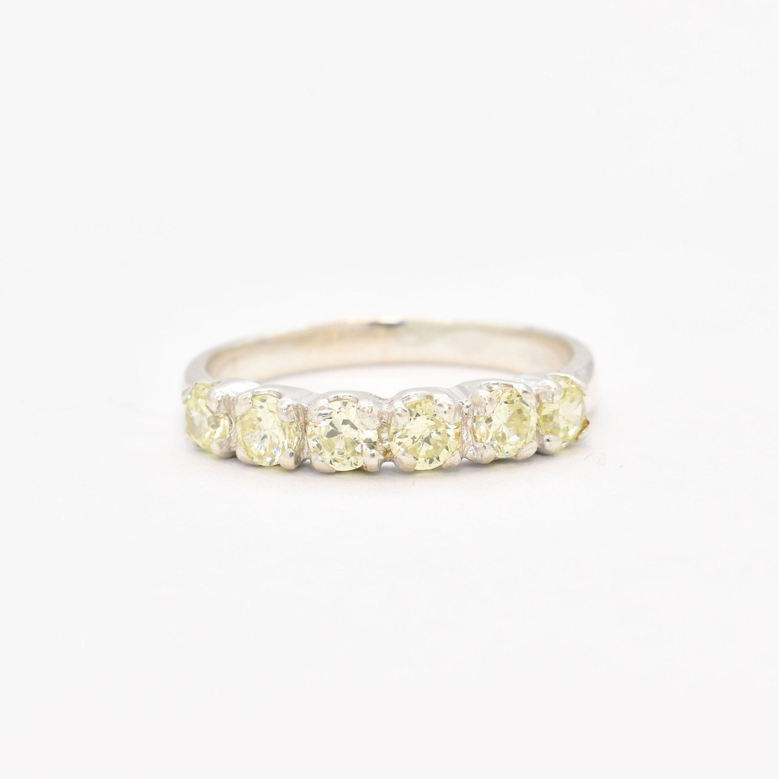 Peridot band ring, August Birthstone, crafted with peridot stones in a solid 925 sterling silver setting, featuring diamond cut clarity for a timeless and elegant look. Perfect for August babies birthday gift ideas.