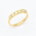 Peridot band ring gift idea combining natural beauty with symbolic meaning for loved ones.