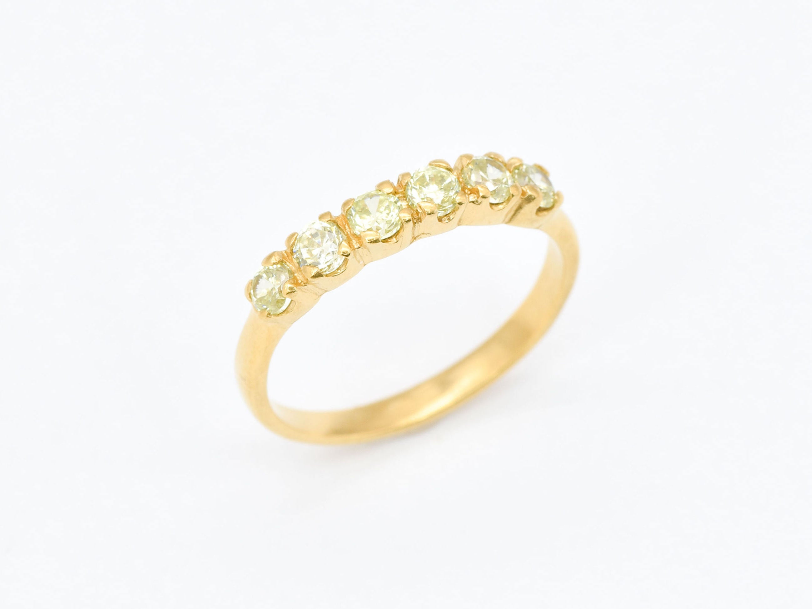 Peridot band ring gift idea combining natural beauty with symbolic meaning for loved ones.