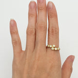 Peridot gold ring paired with minimalist accessories, great for professional or casual settings, complementing neutral and warm-toned outfits.