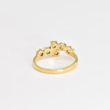 Peridot gold ring with a modern band design, suitable for adding a splash of color and elegance to any look.