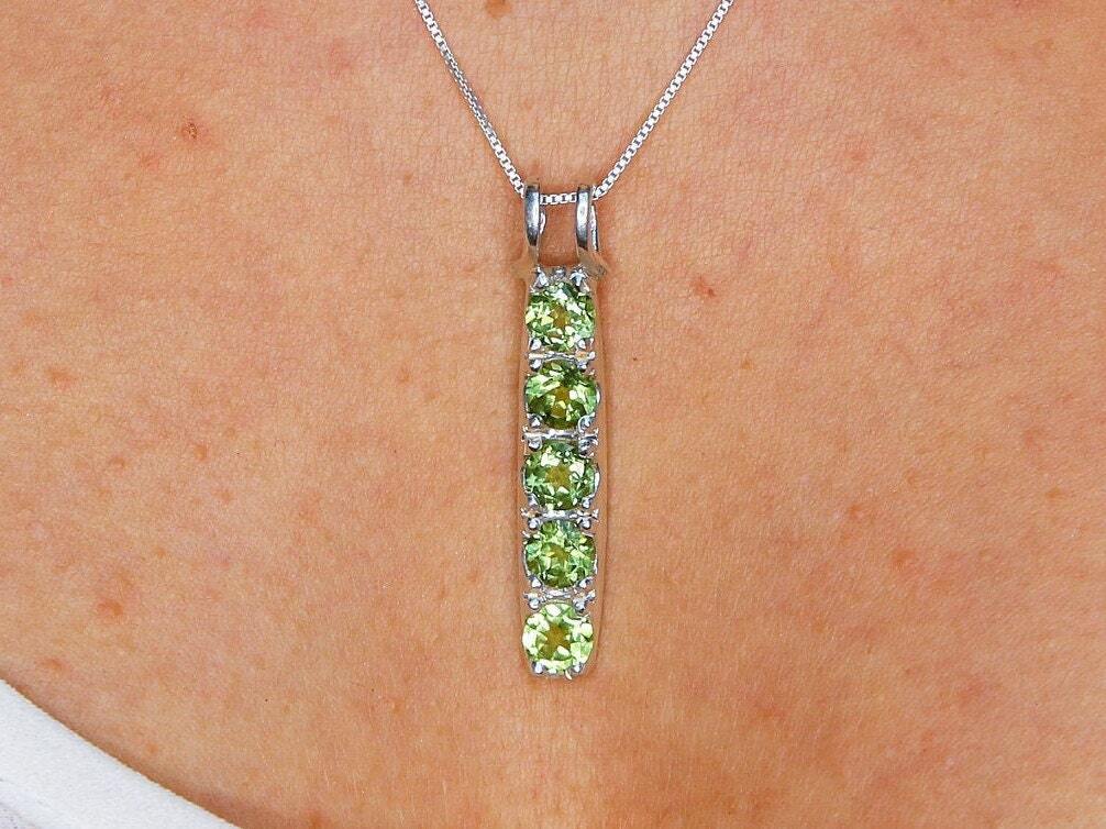 Green Peridot pendant necklace featuring natural peridot in vertical design sourced from Brazil, set in solid 925 sterling silver with diamond cut clarity for a stunning elegant look. Perfect for August birthday gifts.