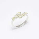 Peridot silver ring designed to bring balance and harmony, crafted with attention to detail and diamond cut clarity.