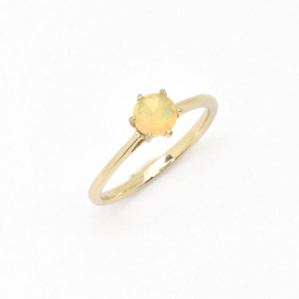 Genuine Fire Opal solitaire ring in 14k solid yellow gold with flashes of fire colors, symbolizing passion and creativity, perfect as an October birthstone engagement, anniversary, or milestone gift.