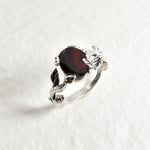 Red garnet ring in a leaf inspired band