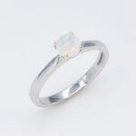Natural Fire Opal solitaire ring set in 18k solid white gold, a timeless jewelry piece symbolizing creativity and passion, the perfect October birthstone gift for anniversaries, engagements, or milestone celebrations.