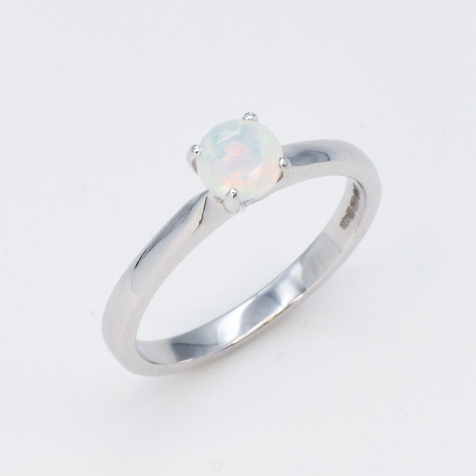 Natural Fire Opal solitaire ring set in 18k solid white gold, a timeless jewelry piece symbolizing creativity and passion, the perfect October birthstone gift for anniversaries, engagements, or milestone celebrations.