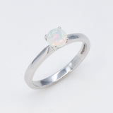 Natural Fire Opal solitaire ring set in 18k solid white gold, a timeless jewelry piece symbolizing creativity and passion, the perfect October birthstone gift for anniversaries, engagements, or milestone celebrations.