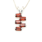 Garnet pendant in modern baguette cut for bold jewelry styling