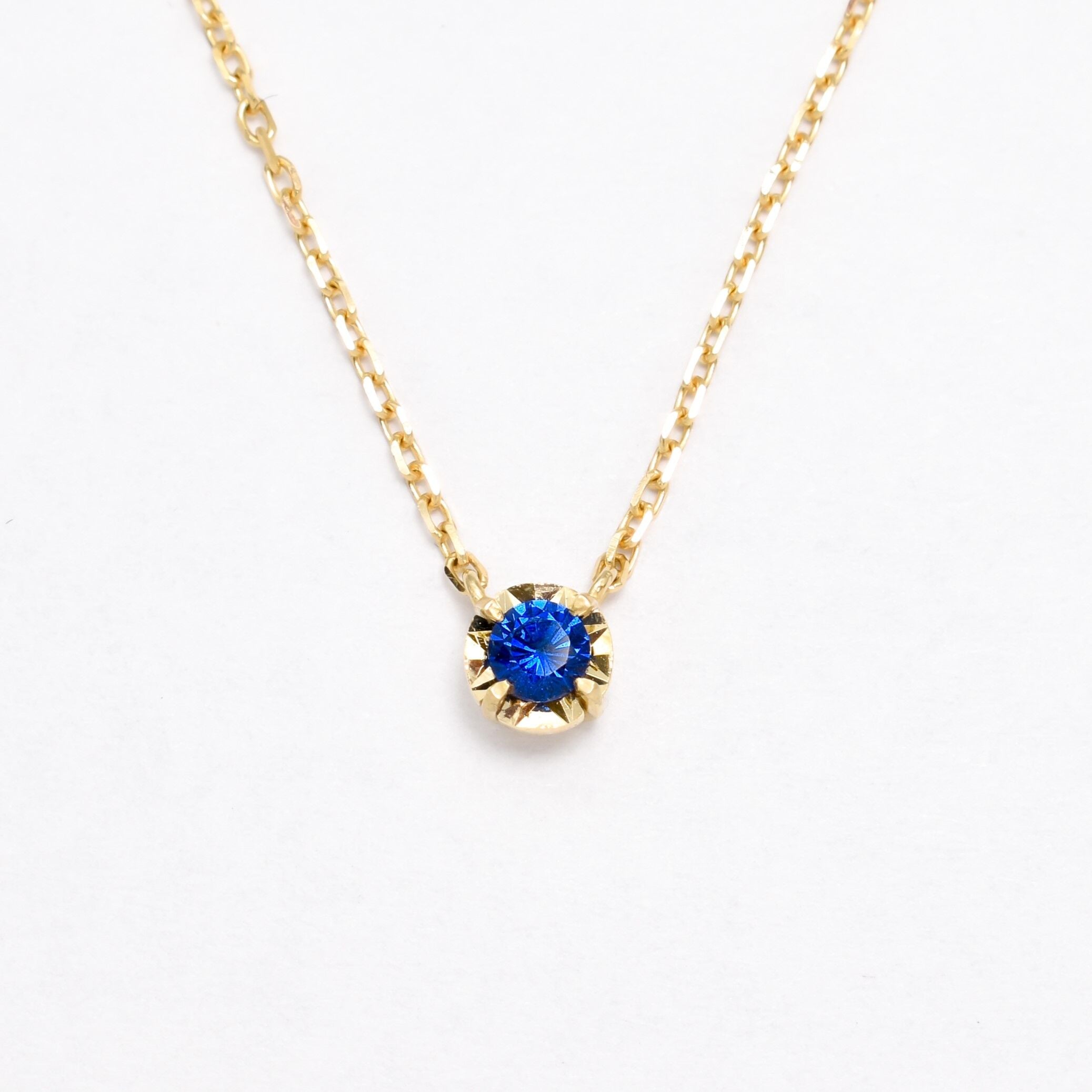 Dainty Round Sapphire Pendant set in Solid 14k Yellow Gold Necklace. September birthstone pendant encouraging truth, mental clarity, and spiritual insight. Luxurious and elegant blue sapphire necklace for wisdom, loyalty, focus. Perfect as a September birthday gift, and a beautiful necklace gift idea for her, as everyday necklace.
