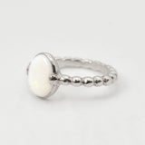 White Opal bubble band solitaire ring in solid 925 sterling silver with rainbow and fire color flashes, offering calming energy and emotional balance, perfect as an October birthstone gift and can be gifted on engagements, anniversaries, or milestone celebrations.