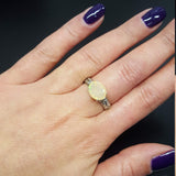 Sterling Silver Fire Opal Ring with horizontal oval cut and engraved ornament band. The 4-prong setting enhances durability, while the opal’s rainbow flashes radiate timeless beauty. Ideal for anniversaries, weddings, and milestone gifts.