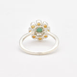 Natural Emerald and Opal Flower Ring in sterling silver with round cabochon opals surrounding a central emerald. Jewelry style is elegant, floral, and artistic with a timeless silver band. Emerald is linked to growth, renewal, and love while Opal is believed to inspire creativity and balance. A meaningful May or Birthstone birthstone gift for birthdays, anniversaries, or special celebrations. Ideal for weddings, garden parties, formal gatherings, or daily elegance.