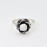 Natural Opal Flower design set in sterling silver ring offering timeless elegance and calming energy perfect as an October birthstone gift for birthdays anniversaries or romantic proposals.