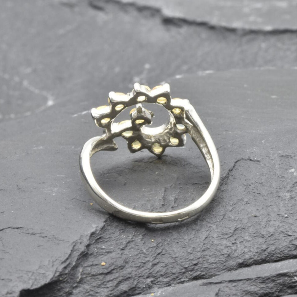 Opal Spiral Ring in sterling silver designed as a sunburst swirl statement jewelry piece offering radiant flashes of fire colors and boho charm, believed to inspire creativity and positivity, making it a thoughtful October birthstone gift idea. Perfect to wear at weddings, parties, and special occasions for a vibrant standout look.