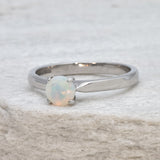 Natural Fire Opal solitaire ring set in 18k solid white gold, a timeless jewelry piece symbolizing creativity and passion, the perfect October birthstone gift for anniversaries, engagements, or milestone celebrations.