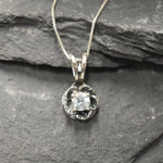 Blue Topaz pendant symbolizing clarity and elegance in floral form