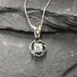 Blue Topaz pendant symbolizing clarity and elegance in floral form