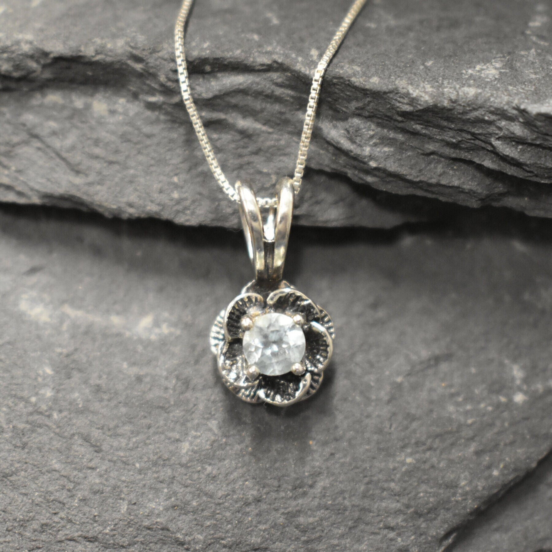Blue Topaz pendant symbolizing clarity and elegance in floral form