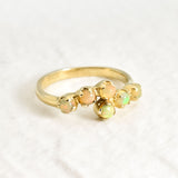 Dainty Opal bypass ring featuring Natural Fire Opals in a gold setting. The bypass design adds elegance and charm while opals are believed to bring hope, inspiration and emotional balance. This makes it a thoughtful October birthstone gift for anniversaries, engagements, weddings and special celebrations.