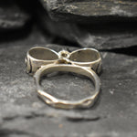 Opal ring in handcrafted solid silver with a ribbon bow style band and white cabochon showing flashes of fire color, a statement design that brightens the hand. Brings creative spark and calm confidence while adding a luminous white accent to any look. A thoughtful October birthstone gift idea for someone special.
Wear to weddings, anniversaries, engagements, date nights, office parties, graduations, and holiday gatherings.