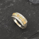 Opal Row Half Eternity Wide Ring in sterling silver featuring natural fire opals with flashes of fire colors, accented by CZ pave for a bold jewelry style. A meaningful October birthstone piece symbolizing balance and inspiration, making it a treasured gift idea. Perfect for weddings, anniversaries, cocktail events, and elegant evening occasions.