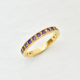 Amethyst gold ring with 1 carat total diamond cut purple stones on polished gold band