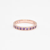 Rose gold amethyst ring with diamond cut purple stones for a vintage look