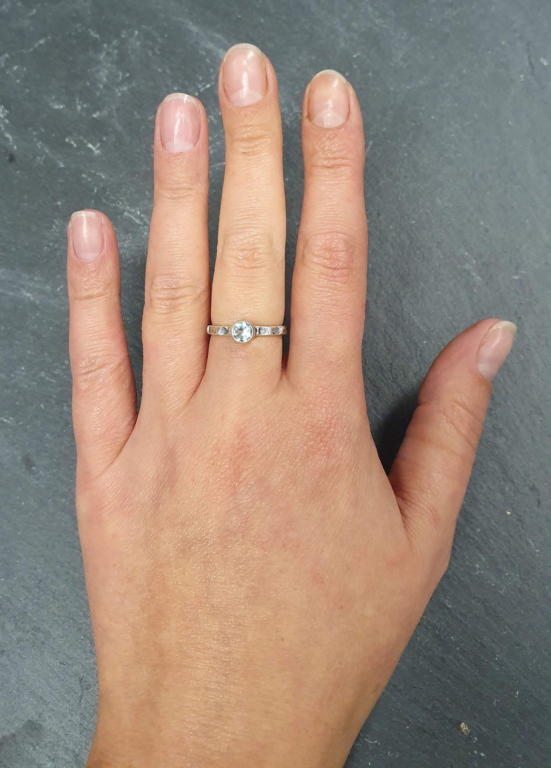 Aquamarine ring with Celtic-inspired design, ideal for cultural events or March birthday girls.