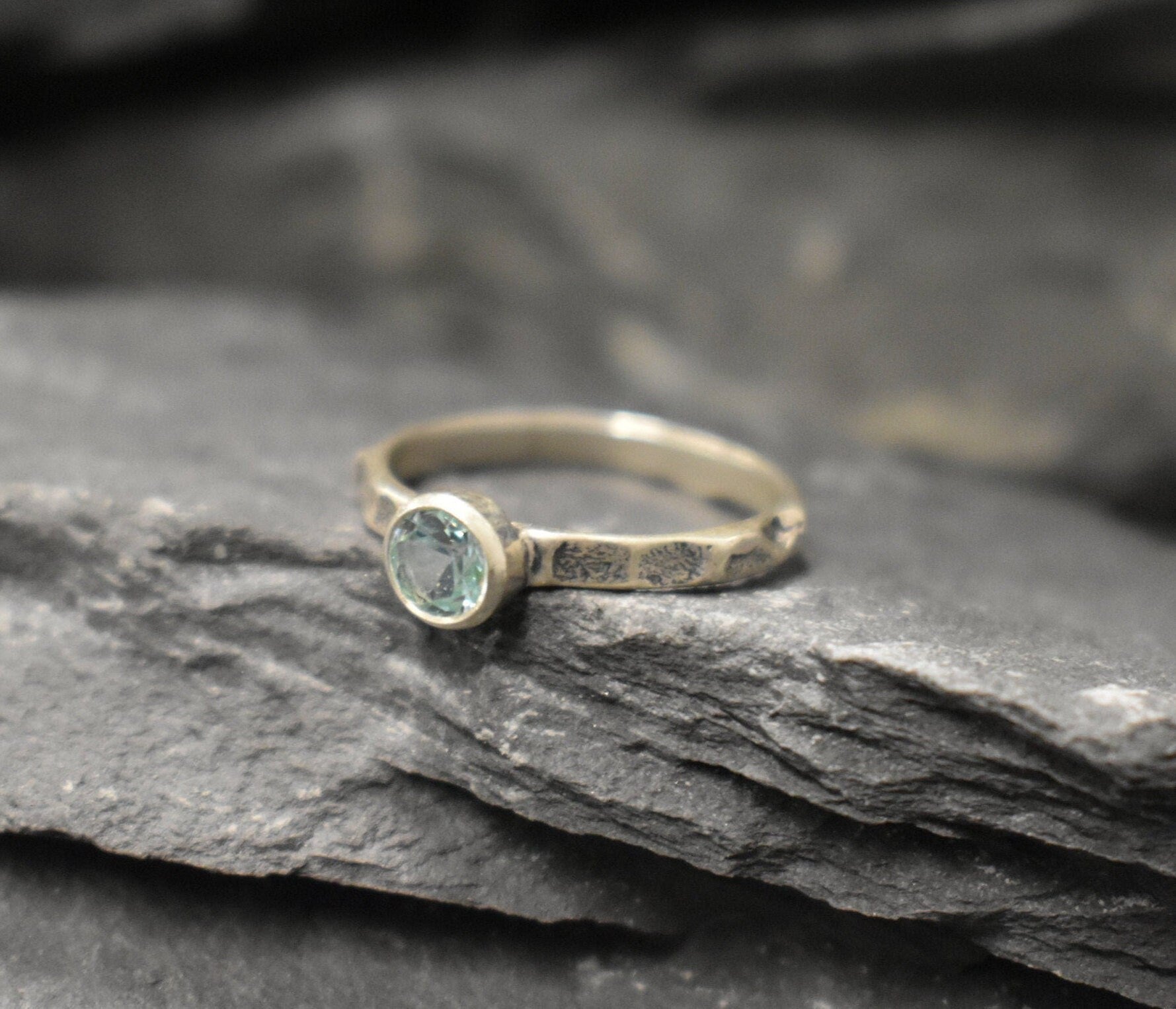 Sleek hammered silver band with Aquamarine, offering a minimalist style and thoughtful birthday gesture.