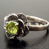 Sterling Silver ring with Peridot center, known for emotional healing, a charming gift for August birthdays or garden parties.