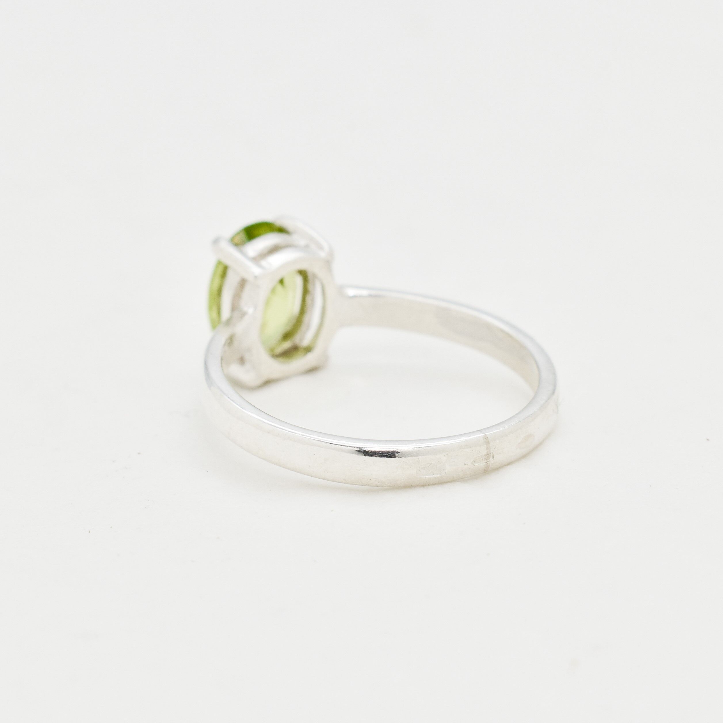 August birthstone Peridot ring, timeless oval cut design, perfect for meaningful gifting or self-celebration.