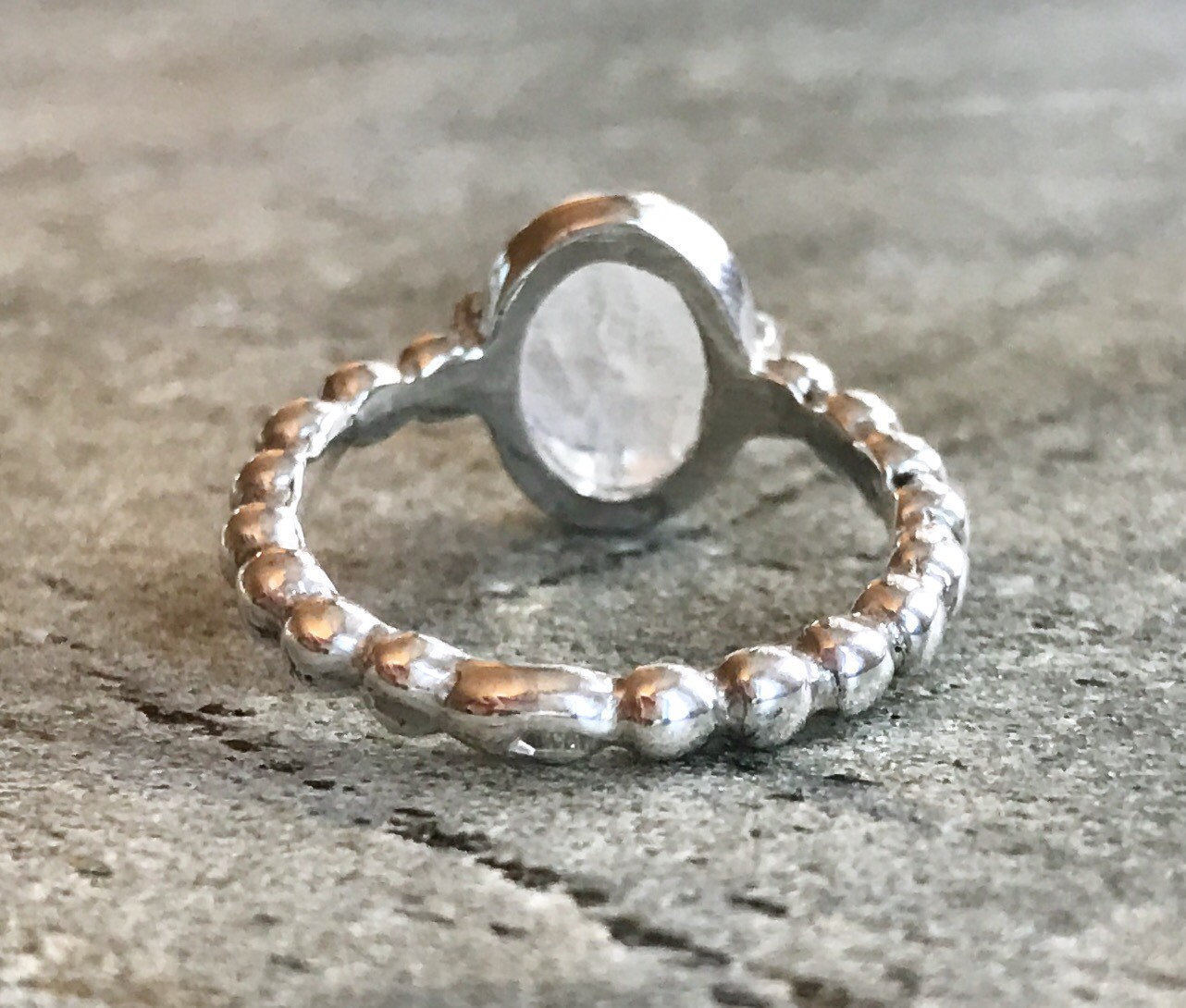 Beaded band Rainbow Moonstone ring in sterling silver adds quiet luxury, helps with inner clarity, fitting for spiritual gifting or quiet moments.