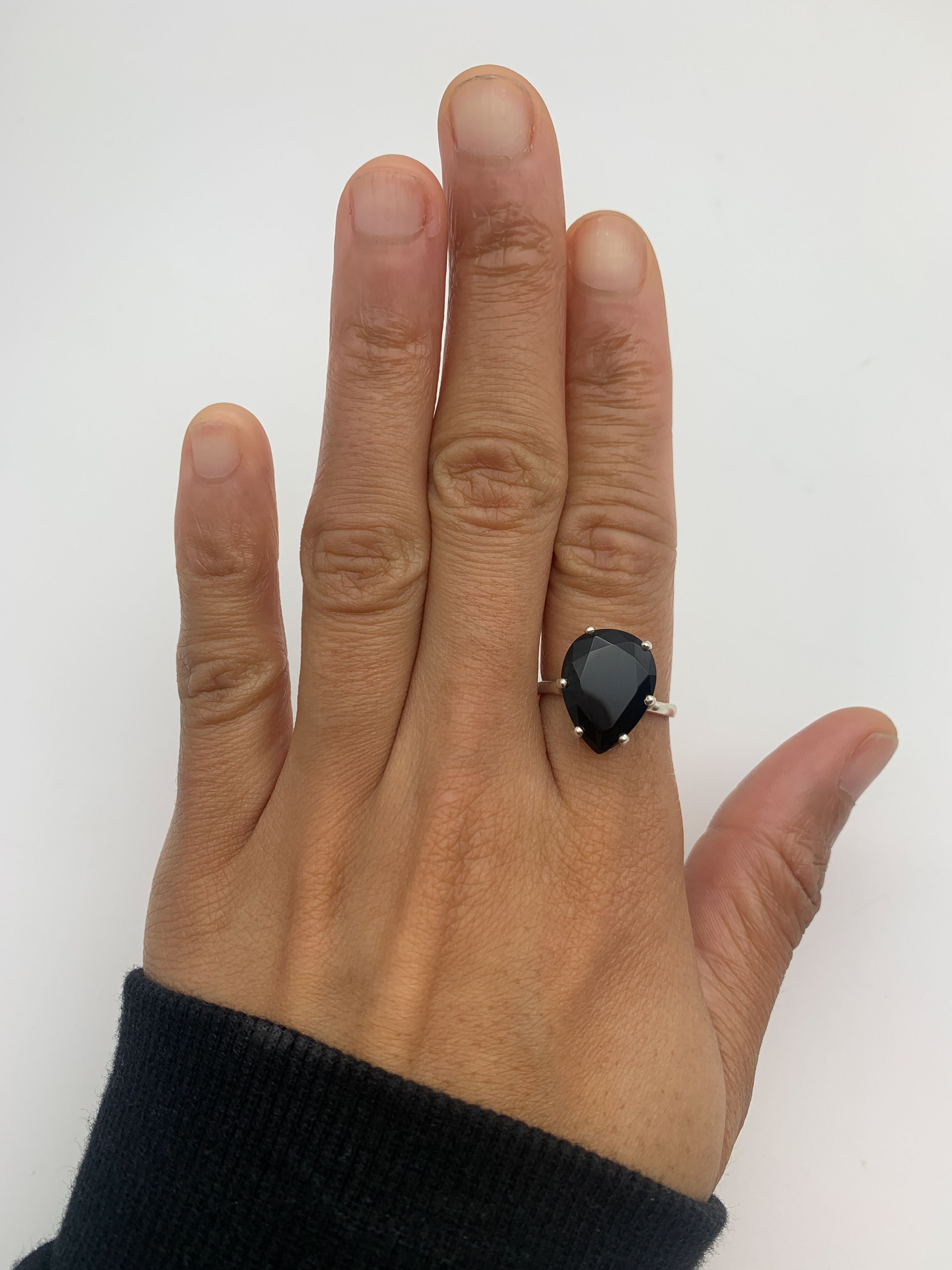 Modern Onyx Ring with silver band pairs with minimalist looks.