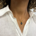 Black hematite pendant that pairs well with white linen top, can be worn for special occasion or for casual look.
