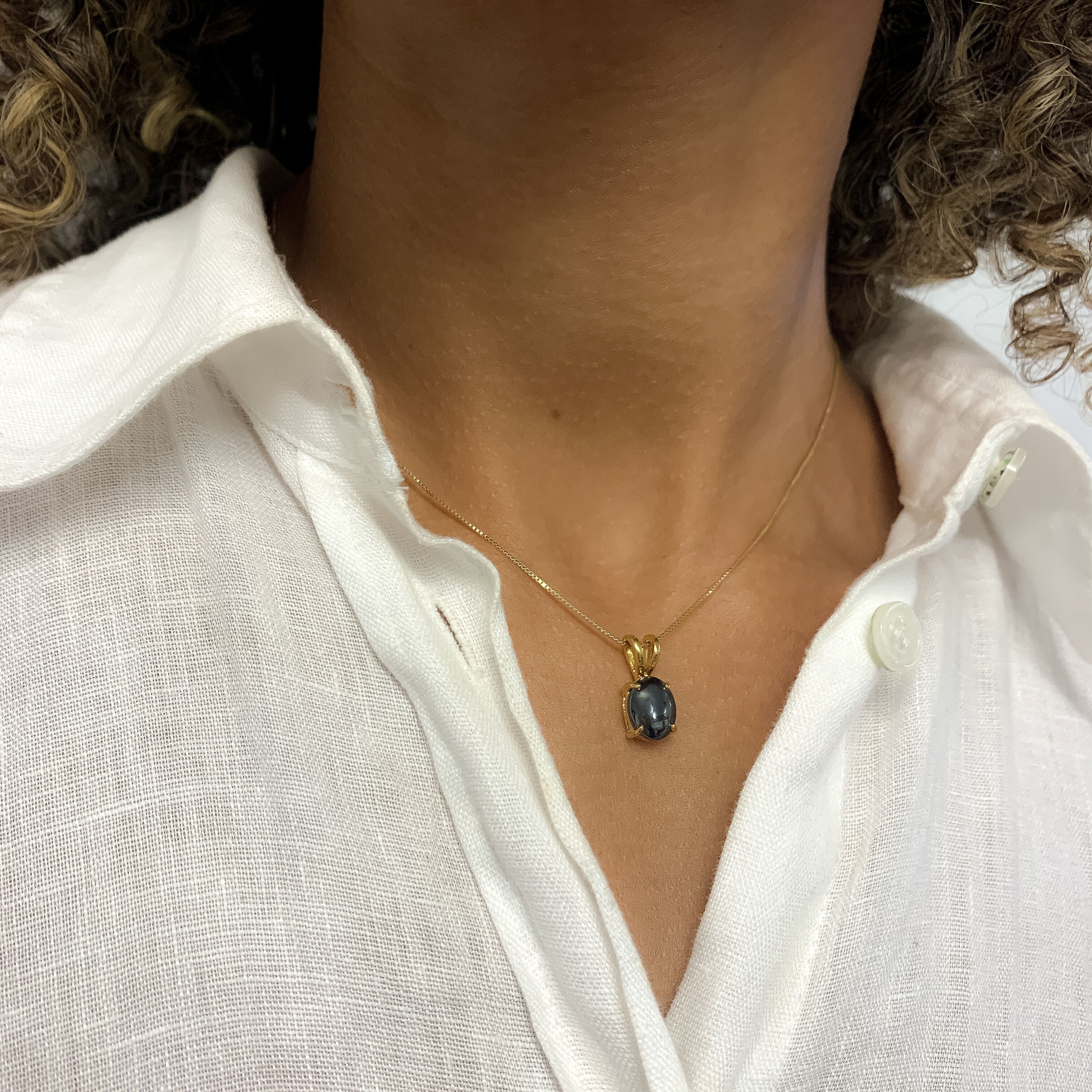 Black hematite pendant that pairs well with white linen top, can be worn for special occasion or for casual look.